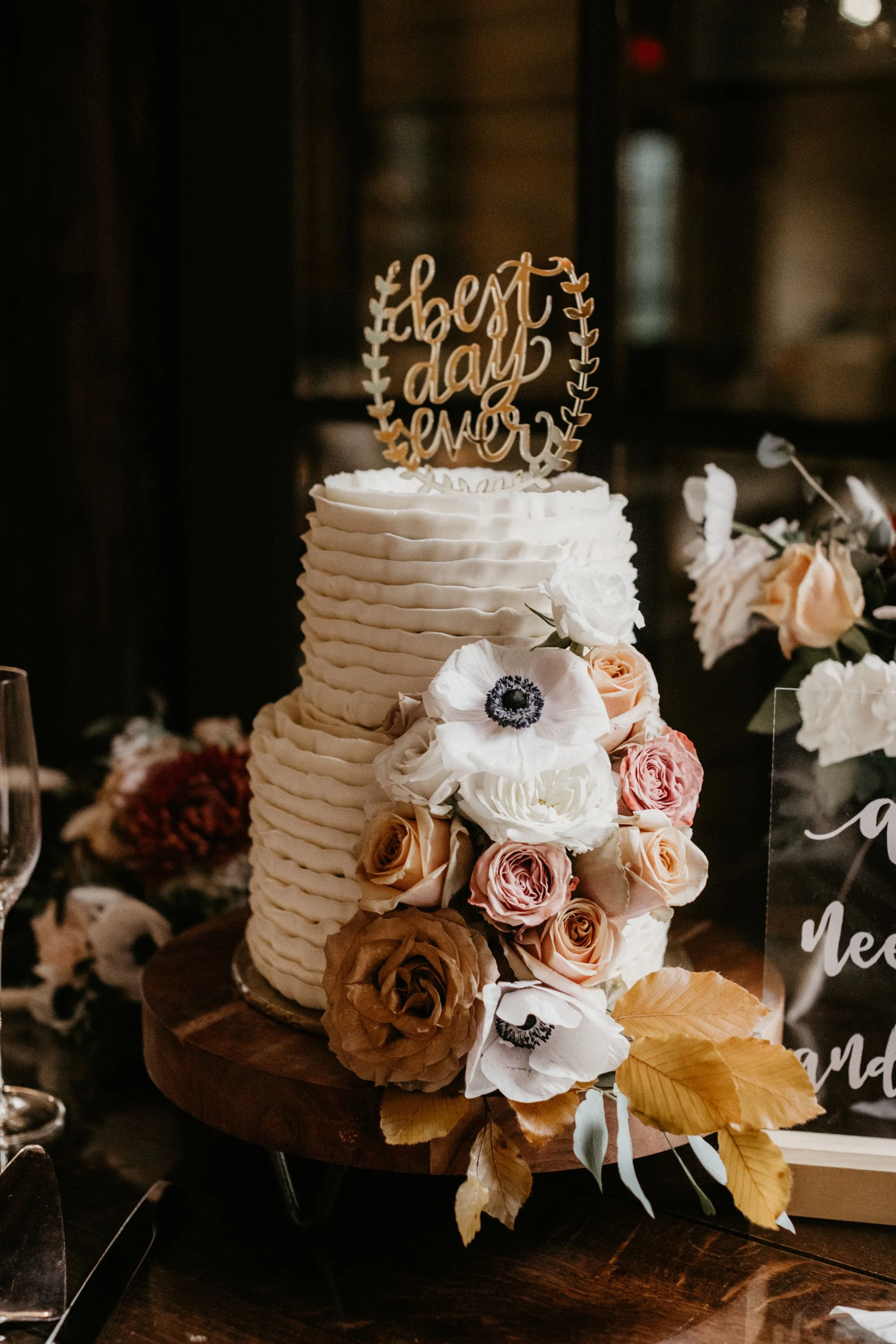 Two-tier ivory wedding cake with roses